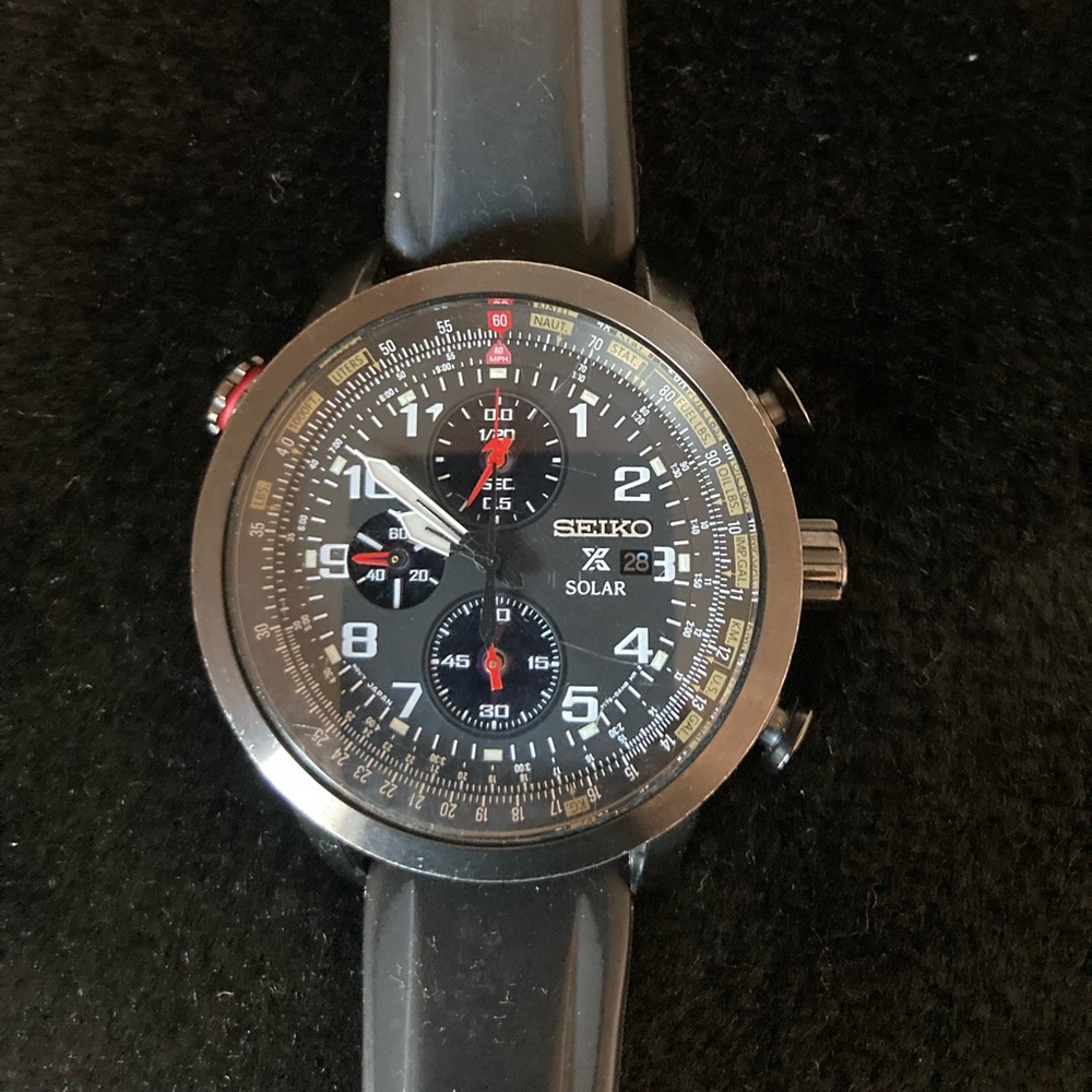 Seiko Solar X Watch with Black, Red, and Stainless Steel Accents
